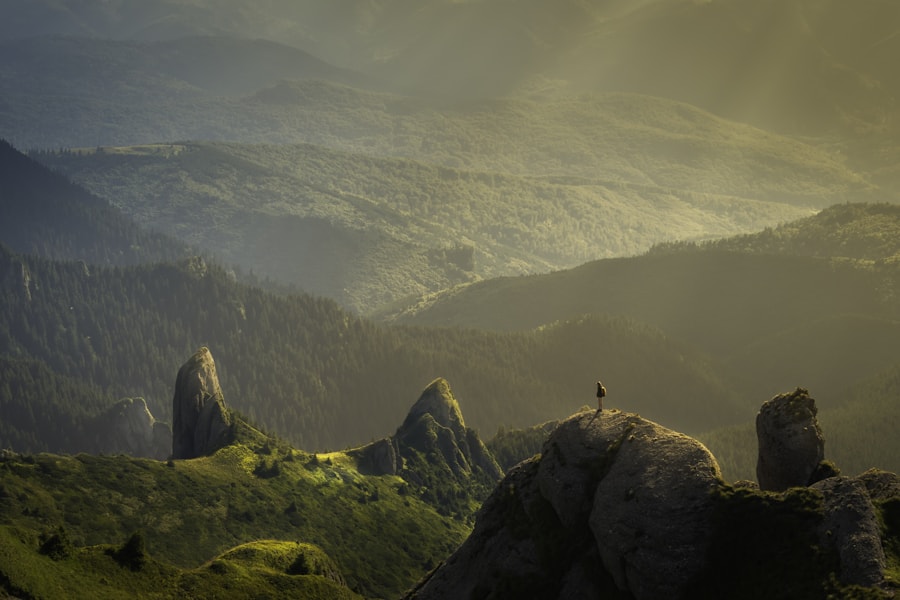 High-dynamic-range mountain scene rendered as a dark under-exposed bracket that keeps highlight detail